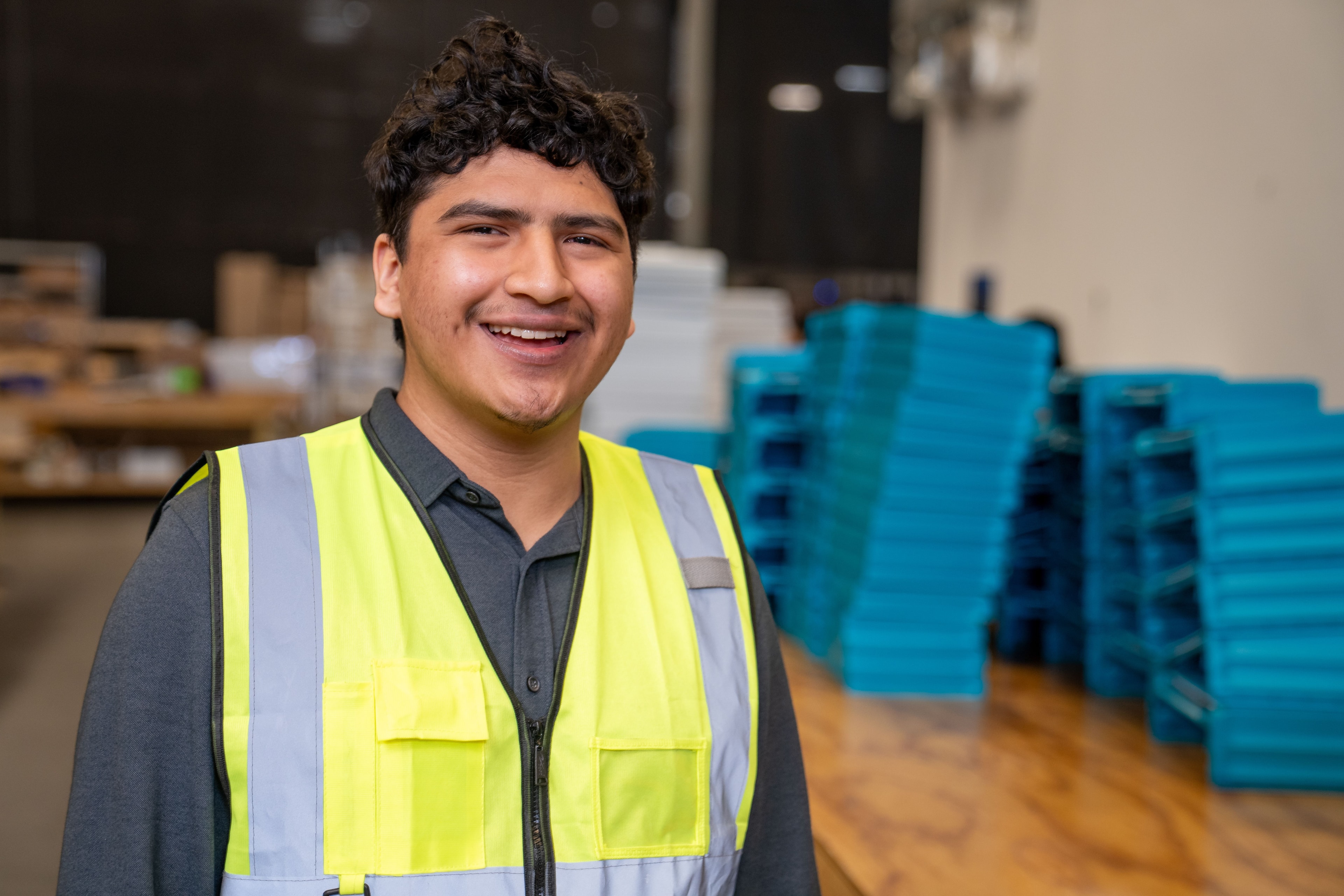 Hector in his warehouse safety vest
