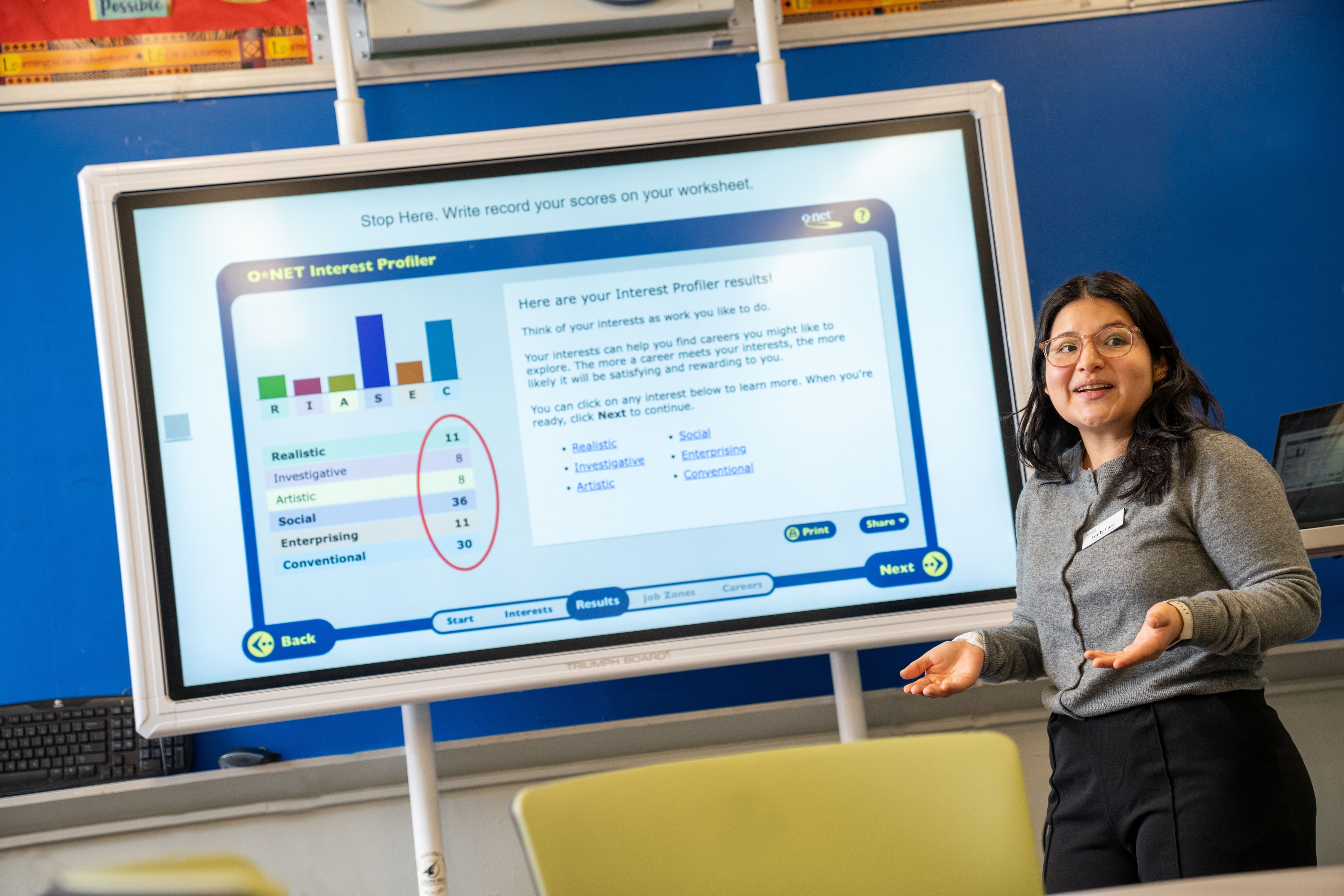 A Bridges Youth Employment Specialist demonstrating a career interest profiler in a classroom