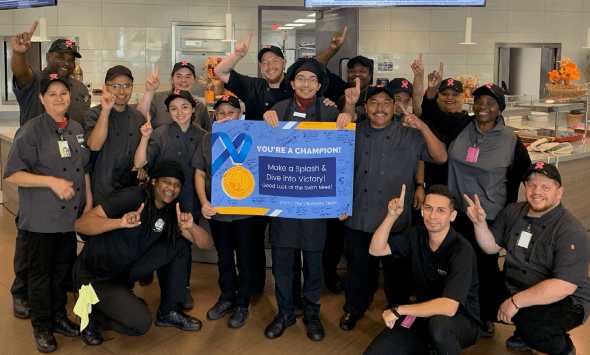 Cameron with his co-workers at the Aramark-managed Capital One cafeteria