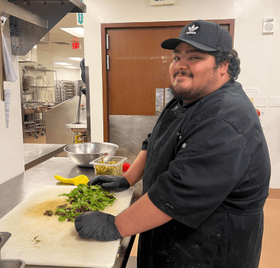 Pedro prepping food in the Dallas Renaissance Hotel kitchen