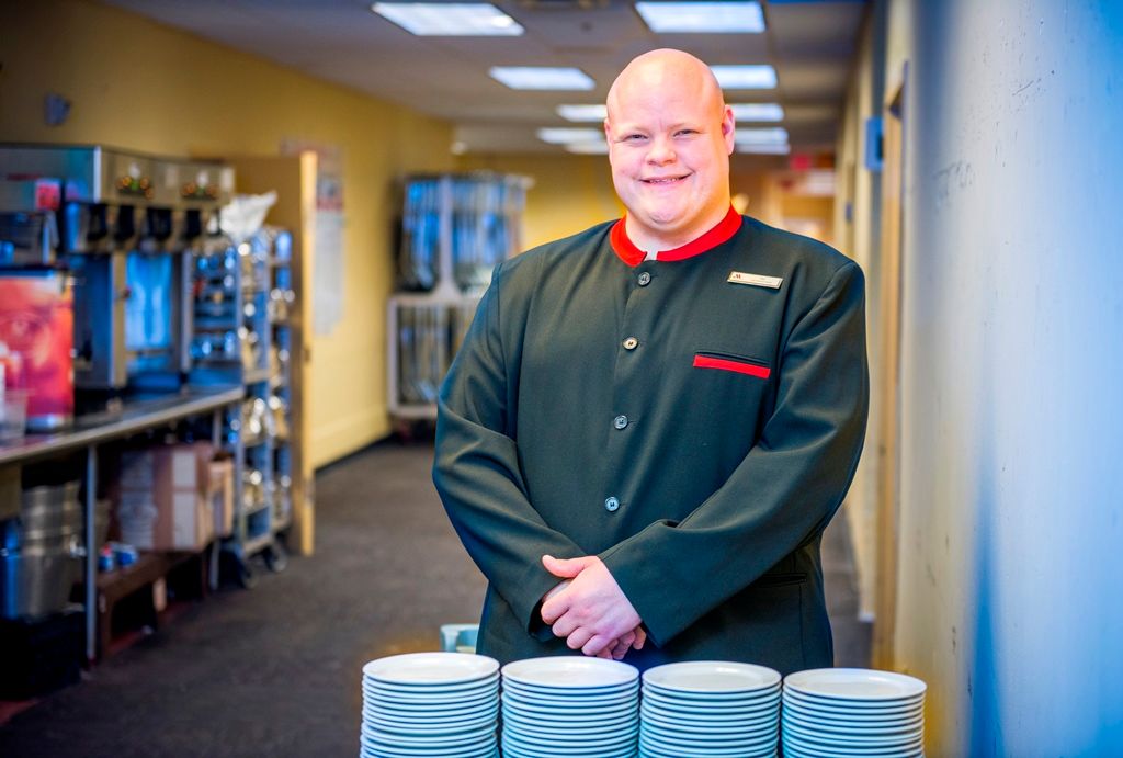 A Bridges-supported hospitality worker in uniform