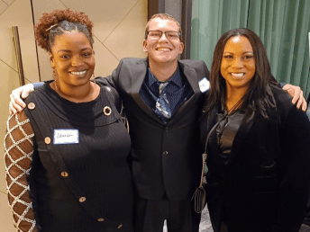 Paul with Bridges employment specialist Erica Jones and Michaels HR manager Lauren Tarpley
